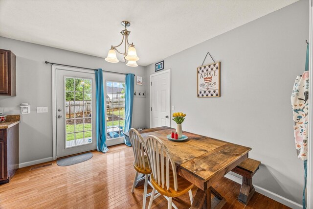 1531 Lake Villa Cir, Cookeville, TN 38506 - dining room with light wood-style flooring, baseboards, and a chandelier