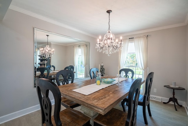 1448 Baker Ln, Lawrenceburg, TN 38464 - dining space featuring a chandelier, baseboards, wood finished floors, and ornamental molding