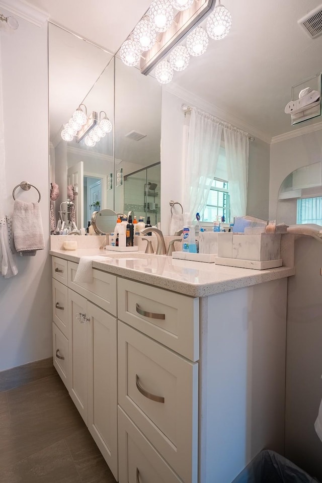 1448 Baker Ln, Lawrenceburg, TN 38464 - full bathroom featuring ornamental molding, double vanity, a stall shower, and baseboards