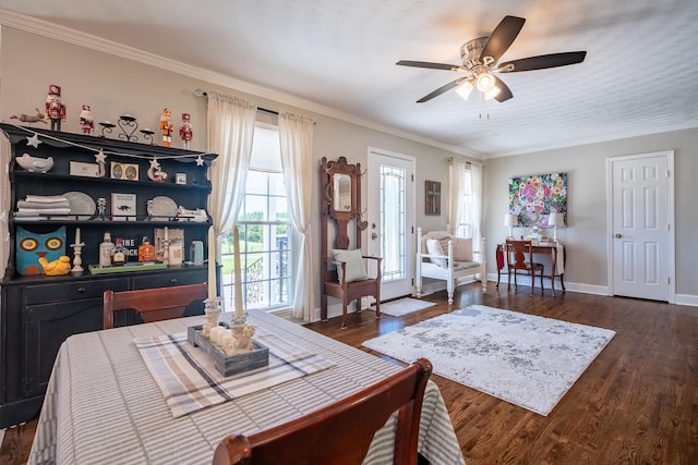 1448 Baker Ln, Lawrenceburg, TN 38464 - dining area with dark wood-style flooring, a ceiling fan, ornamental molding, and baseboards