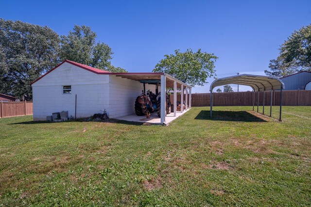 1448 Baker Ln, Lawrenceburg, TN 38464 - view of yard featuring a detached carport and a patio area