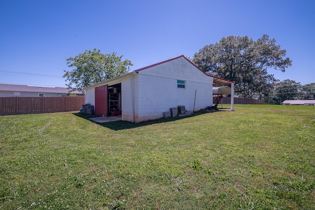1448 Baker Ln, Lawrenceburg, TN 38464 - view of property exterior with concrete block siding and an outbuilding