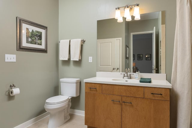 200 Manufacturers Rd Apt 241, Chattanooga, TN 37405 - bathroom featuring baseboards, toilet, vanity, and tile patterned flooring