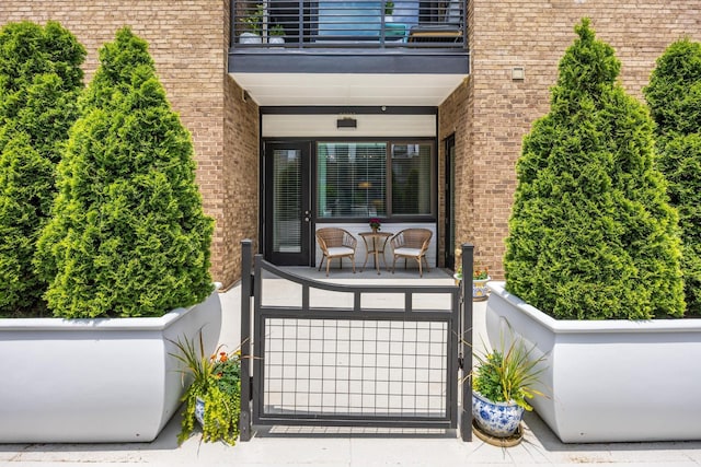 200 Manufacturers Rd Apt 241, Chattanooga, TN 37405 - entrance to property featuring a balcony, covered porch, and brick siding