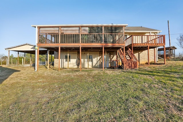 5430 Stacy Springs Rd, Springfield, TN 37172 - back of property with a sunroom, a wooden deck, a carport, a lawn, and stairway