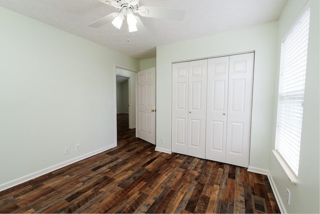 405 Parish Pl, Franklin, TN 37067 - unfurnished bedroom featuring dark wood-type flooring, baseboards, a closet, and ceiling fan