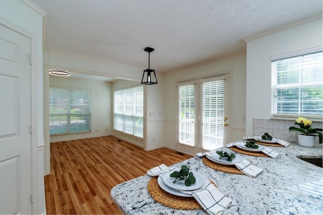 405 Parish Pl, Franklin, TN 37067 - dining space featuring crown molding and light wood-type flooring