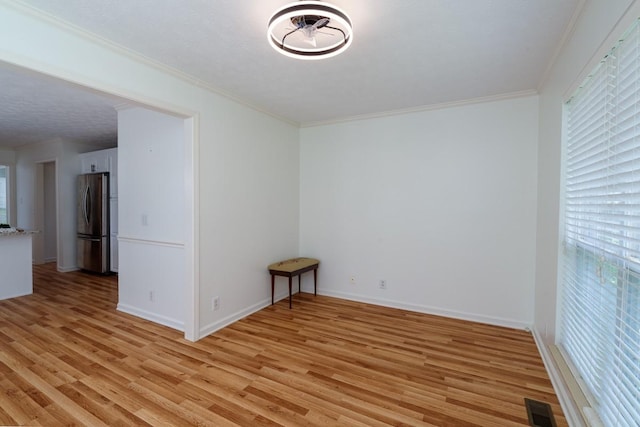 405 Parish Pl, Franklin, TN 37067 - empty room featuring plenty of natural light, light wood finished floors, ornamental molding, and baseboards