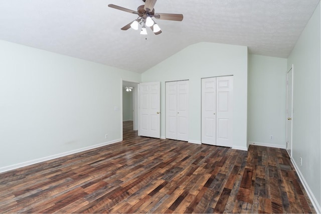 405 Parish Pl, Franklin, TN 37067 - unfurnished bedroom featuring two closets, dark wood-style floors, lofted ceiling, baseboards, and a ceiling fan