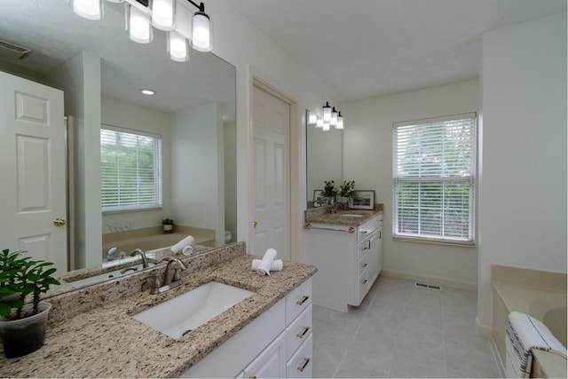 405 Parish Pl, Franklin, TN 37067 - bathroom featuring vanity, a bath, tile patterned flooring, and baseboards