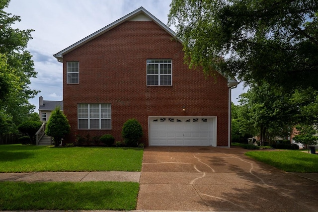 405 Parish Pl, Franklin, TN 37067 - view of side of home with a garage, concrete driveway, a lawn, and brick siding