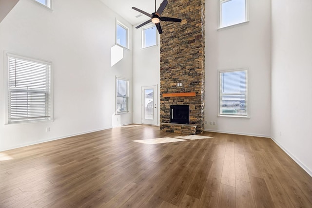 129 Willow Bend Dr, Mount Juliet, TN 37122 - unfurnished living room with high vaulted ceiling, ceiling fan, a fireplace, hardwood / wood-style flooring, and baseboards