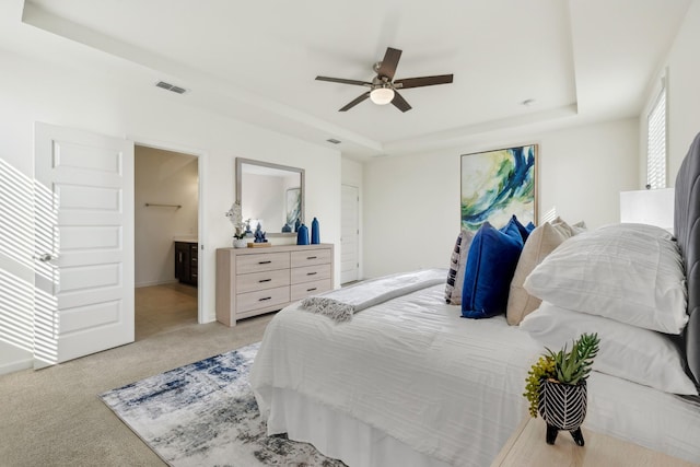129 Willow Bend Dr, Mount Juliet, TN 37122 - bedroom with a raised ceiling, light carpet, ceiling fan, and ensuite bathroom