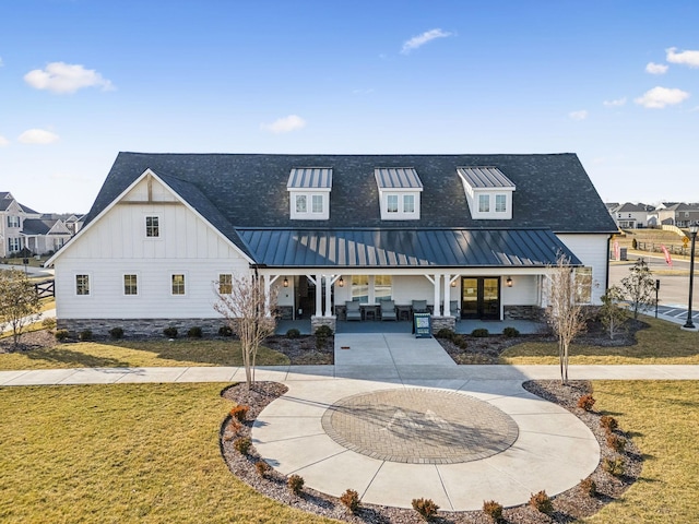 129 Willow Bend Dr, Mount Juliet, TN 37122 - view of front of home featuring french doors, board and batten siding, a front yard, and a standing seam roof