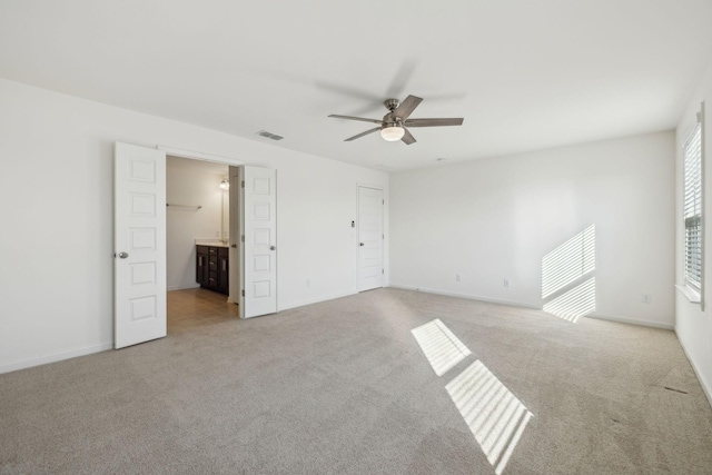 129 Willow Bend Dr, Mount Juliet, TN 37122 - unfurnished bedroom with light colored carpet, baseboards, connected bathroom, and a ceiling fan