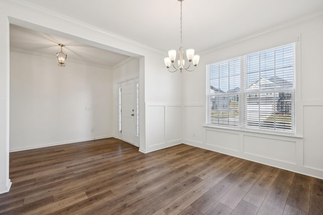 129 Willow Bend Dr, Mount Juliet, TN 37122 - unfurnished dining area featuring dark wood finished floors, a chandelier, a decorative wall, wainscoting, and ornamental molding