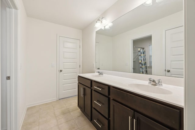 129 Willow Bend Dr, Mount Juliet, TN 37122 - full bathroom with double vanity, tile patterned floors, and baseboards