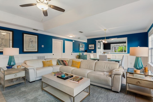 725 Forest Glen Cir, Murfreesboro, TN 37128 - living room with ornamental molding, a decorative wall, a ceiling fan, a wainscoted wall, and wood finished floors