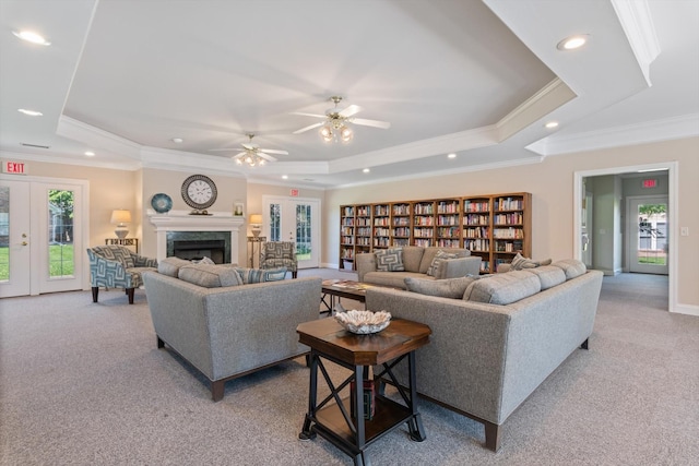725 Forest Glen Cir, Murfreesboro, TN 37128 - living room featuring a tray ceiling, light carpet, ornamental molding, recessed lighting, and a ceiling fan