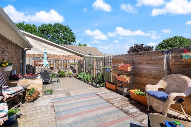 725 Forest Glen Cir, Murfreesboro, TN 37128 - wooden deck with a fenced backyard, outdoor dining area, and a patio area