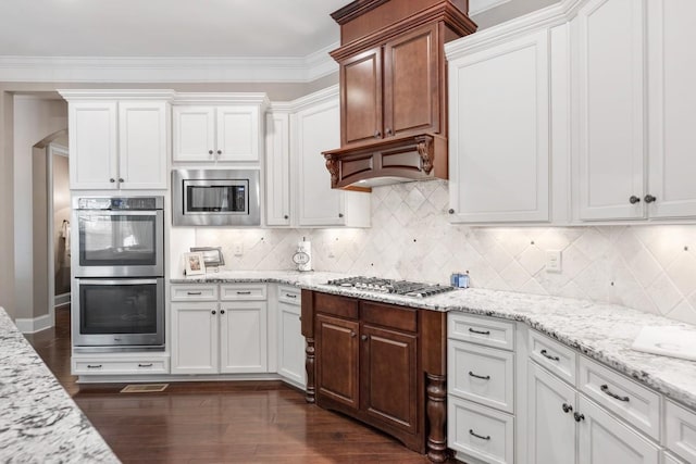 1237 Potter Ln, Gallatin, TN 37066 - kitchen featuring appliances with stainless steel finishes, white cabinetry, dark wood finished floors, and decorative backsplash