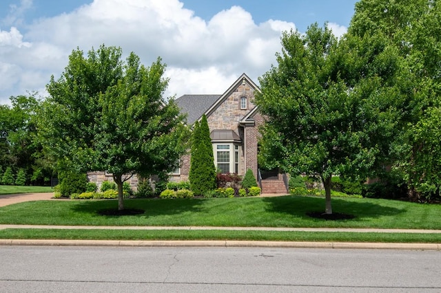 1237 Potter Ln, Gallatin, TN 37066 - view of property hidden behind natural elements with a front yard, stone siding, and brick siding