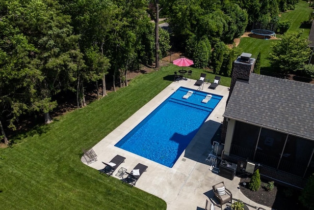 1237 Potter Ln, Gallatin, TN 37066 - outdoor pool featuring a trampoline, a patio area, a lawn, and a sunroom