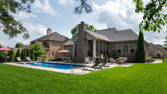 1237 Potter Ln, Gallatin, TN 37066 - rear view of house featuring brick siding, a patio, a sunroom, and roof with shingles