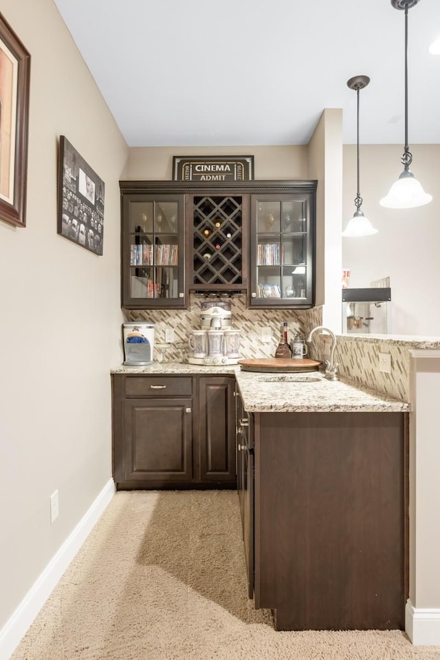 1237 Potter Ln, Gallatin, TN 37066 - indoor wet bar with decorative backsplash, baseboards, hanging light fixtures, and light carpet
