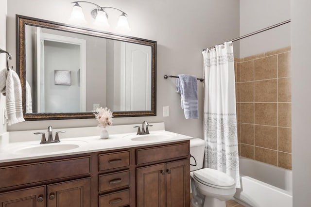 1237 Potter Ln, Gallatin, TN 37066 - bathroom featuring toilet, double vanity, and shower / bath combo