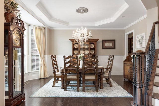 1237 Potter Ln, Gallatin, TN 37066 - dining space featuring a chandelier, a raised ceiling, dark wood-style floors, a wainscoted wall, and stairs