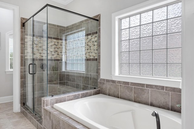1237 Potter Ln, Gallatin, TN 37066 - bathroom featuring a garden tub, a stall shower, healthy amount of natural light, and baseboards