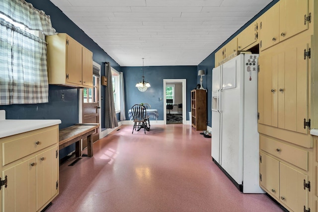 4957 Decatur Highway Highway, Ten Mile, TN 37880 - kitchen with white refrigerator with ice dispenser, cream cabinets, a chandelier, and baseboards