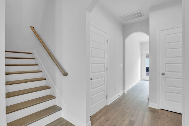 130 Beignet Aly, Hendersonville, TN 37075 - staircase with arched walkways, wood finished floors, and baseboards