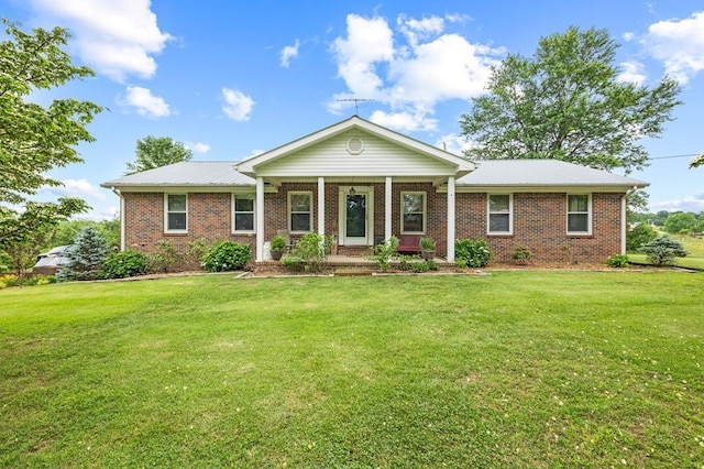 1000 Burgess Mill Rd, Cookeville, TN 38506 - view of front of property with brick siding, a front lawn, and covered porch