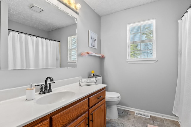 5024 Short Mountain Hwy, Smithville, TN 37166 - bathroom featuring vanity, baseboards, toilet, and a textured ceiling