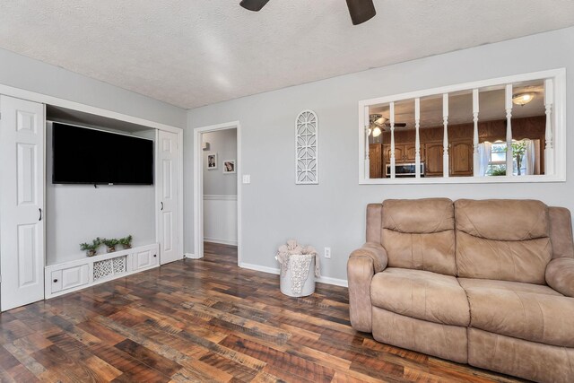 5024 Short Mountain Hwy, Smithville, TN 37166 - living area with ceiling fan, wood finished floors, a textured ceiling, and baseboards