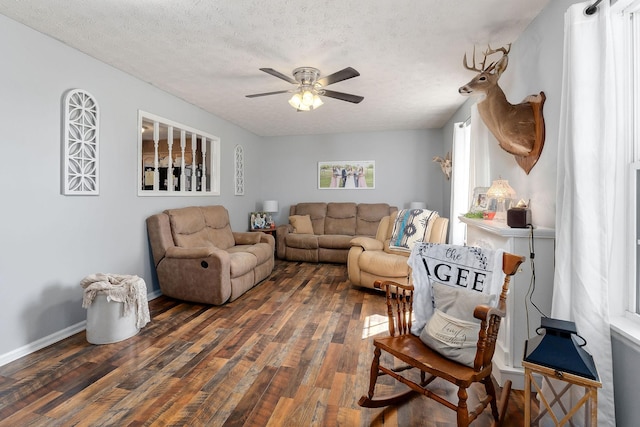 5024 Short Mountain Hwy, Smithville, TN 37166 - living room with wood finished floors, a ceiling fan, a textured ceiling, and baseboards