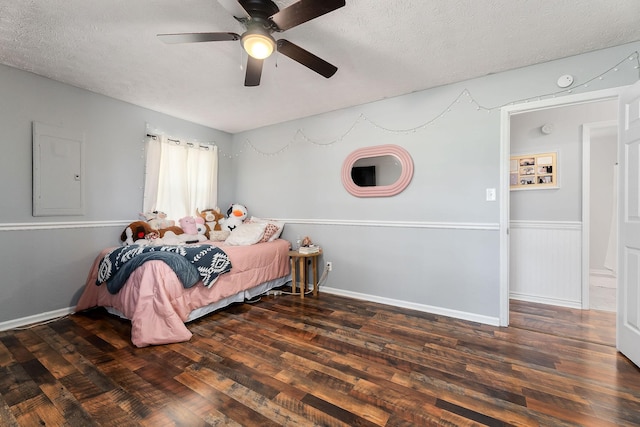 5024 Short Mountain Hwy, Smithville, TN 37166 - bedroom featuring electric panel, a textured ceiling, wood finished floors, and a ceiling fan