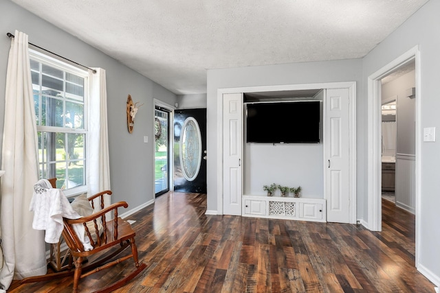 5024 Short Mountain Hwy, Smithville, TN 37166 - entryway with dark wood-style floors, a textured ceiling, and baseboards