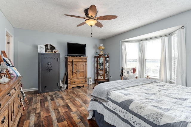 5024 Short Mountain Hwy, Smithville, TN 37166 - bedroom featuring dark wood finished floors, a textured ceiling, baseboards, and ceiling fan