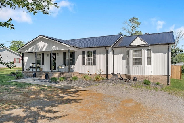 5024 Short Mountain Hwy, Smithville, TN 37166 - modern farmhouse featuring a porch, metal roof, and crawl space