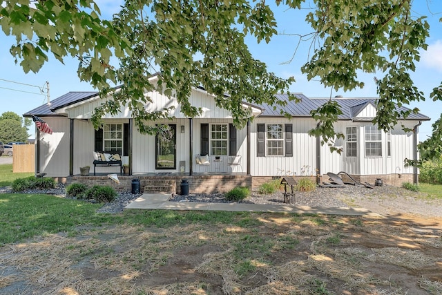 5024 Short Mountain Hwy, Smithville, TN 37166 - modern farmhouse featuring a porch, metal roof, a standing seam roof, and crawl space