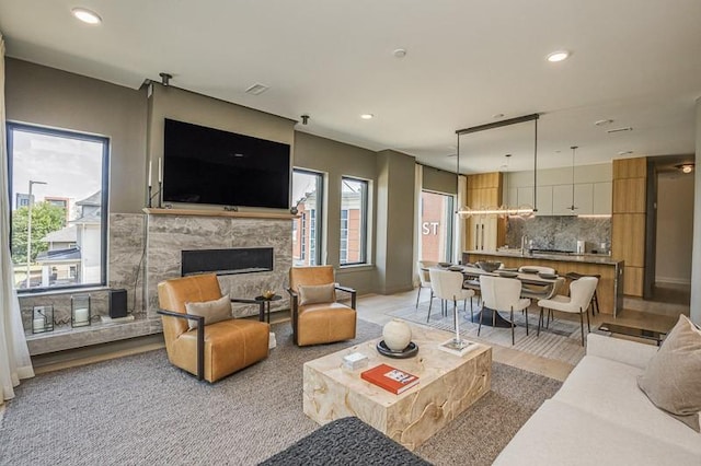 1030 17th Ave S Unit 201, Nashville, TN 37212 - living room with plenty of natural light, a fireplace, and recessed lighting