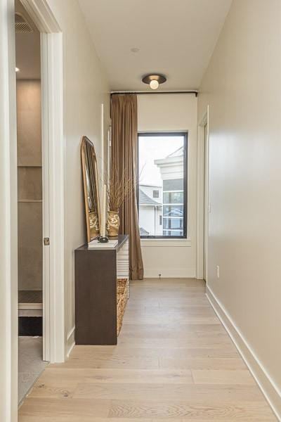 1030 17th Ave S Unit 201, Nashville, TN 37212 - corridor featuring light wood-style floors and baseboards