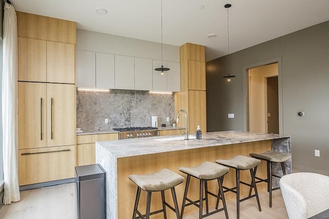 1030 17th Ave S Unit 201, Nashville, TN 37212 - kitchen featuring modern cabinets and light wood-style floors