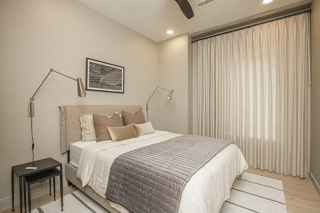 1030 17th Ave S Unit 201, Nashville, TN 37212 - bedroom with light wood finished floors, recessed lighting, baseboards, and ceiling fan