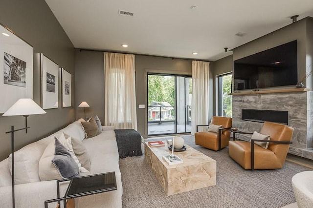 1030 17th Ave S Unit 201, Nashville, TN 37212 - living room with carpet floors, a premium fireplace, and recessed lighting