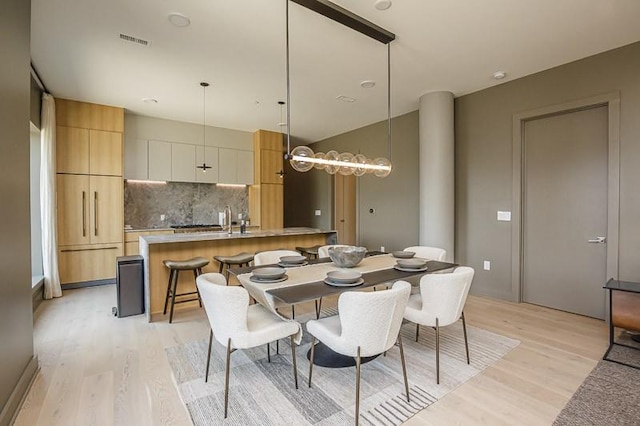 1030 17th Ave S Unit 201, Nashville, TN 37212 - dining room with light wood-style floors