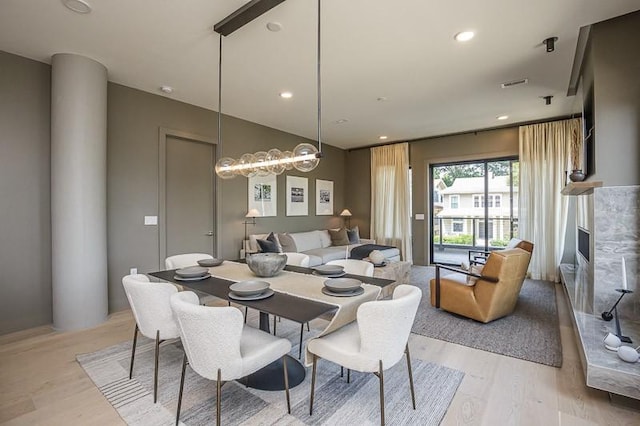 1030 17th Ave S Unit 201, Nashville, TN 37212 - dining area with light wood-style flooring and recessed lighting